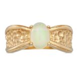 AN OPAL RING, to a textured 9ct gold mount, size M