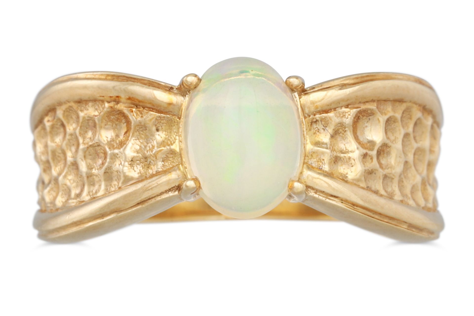 AN OPAL RING, to a textured 9ct gold mount, size M