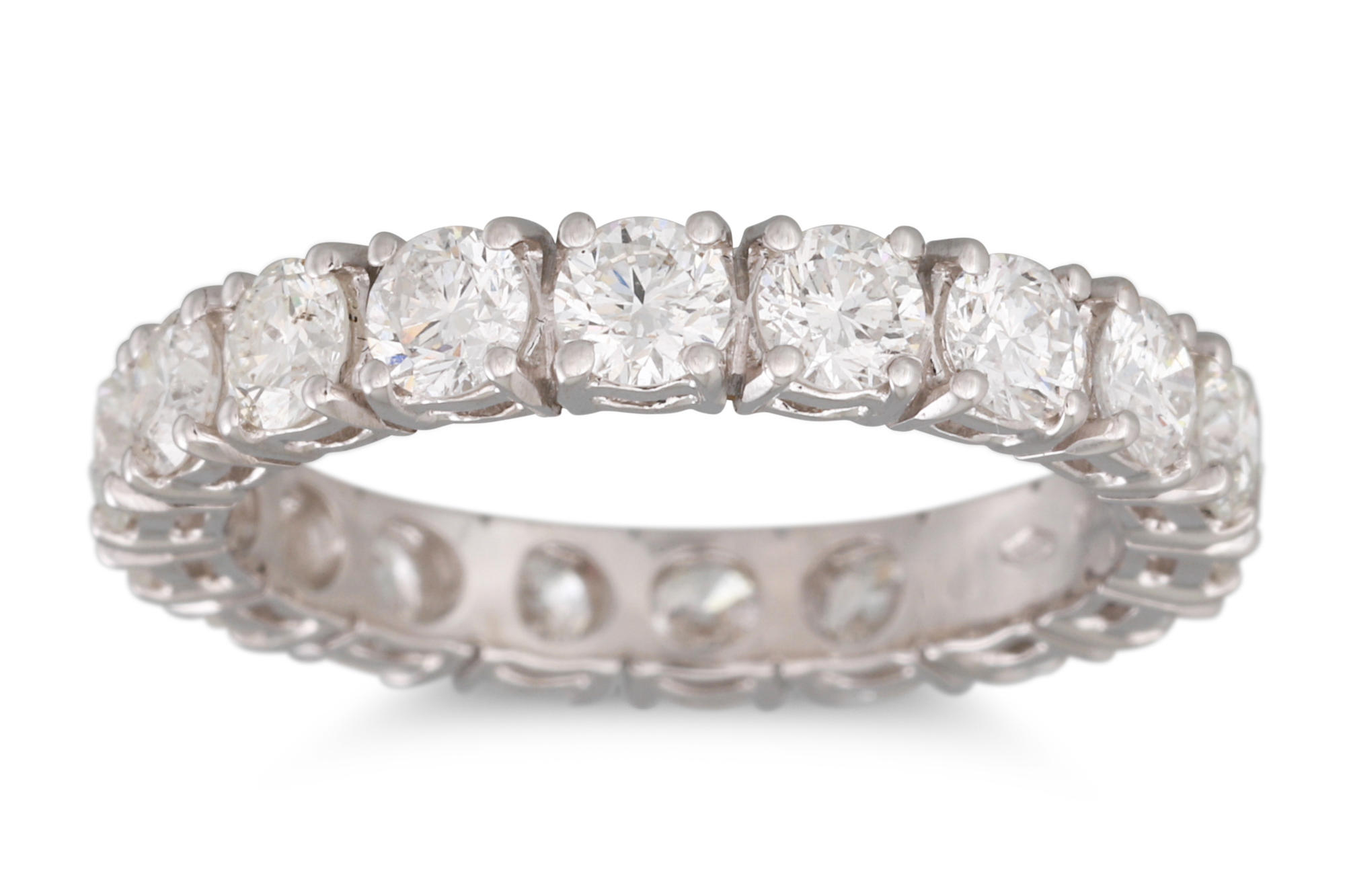 A DIAMOND ETERNITY RING, the brilliant cut diamonds, mounted in 18ct white gold. Estimated: weight