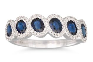A DIAMOND AND SAPPHIRE CLUSTER RING, mounted in 18ct gold, size N - O