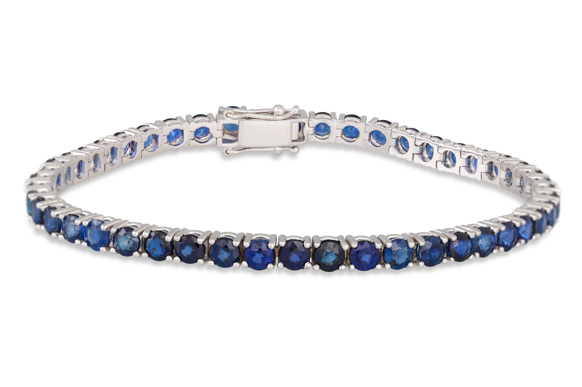 A SAPPHIRE LINE BRACELET, the circular stones mounted in 18ct yellow gold. Estimated: weight of