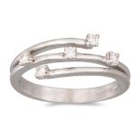 A DIAMOND SET CROSSOVER RING, mounted in 18ct white gold, size M