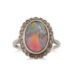 A DIAMOND AND OPAL RING, the oval opal to a old cut diamond surround, mounted in platinum, size O