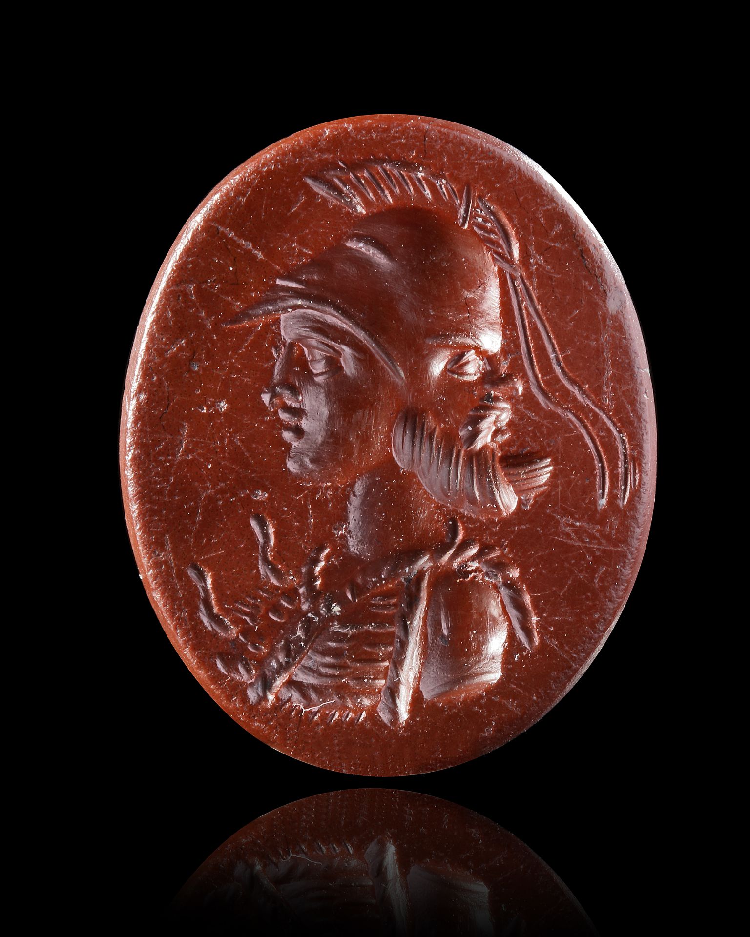 A DARK RED INTAGLIO OF MINERVA, 2ND CENTURY AD