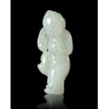 A CHINESE JADE CARVED FIGURE