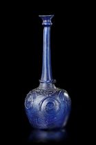 A LARGE MOULD-BLOWN BLUE GLASS BOTTLE-VASE OR SPRINKLER, PERSIA, 12TH CENTURY