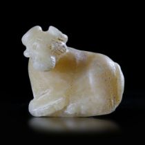 A LARGE AMULET/SEAL IN THE SHAPE OF A RECLINING BULL, NEAR EASTERN, 3RD MILLENNIUM BC