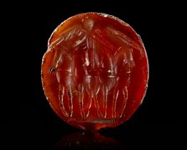 A CARNELIAN INTAGLIO OF A FACING QUADRIGA, 1ST CENTURY AD