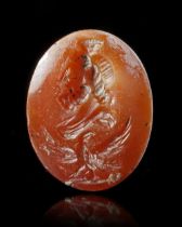 A ROMAN INTAGLIO OF SERAPIS WITH EAGLE, 1ST-2ND CENTURY AD