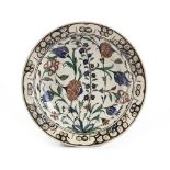 AN IZNIK 'STORM IN A TEACUP' DESIGN POTTERY DISH, TURKEY, 16TH CENTURY