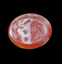 A CARNELIAN INTAGLIO OF A HEAD OF A SATYR, 1ST-2ND CENTURY AD