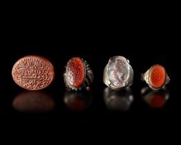 A GROUP OF SILVER RINGS AND A SEAL, QAJAR, 18TH-19TH CENTURY