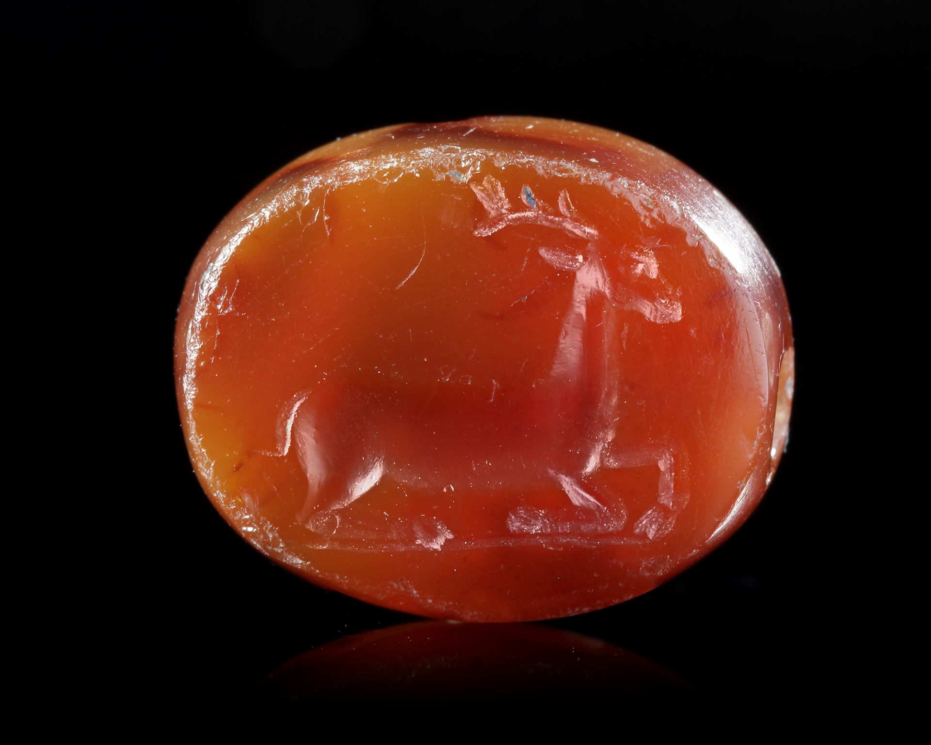 AN AGATE SCARABOID EAST GREEK WITH A STAG, CIRCA 500 BC