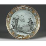 A CHINESE EN GRISAILLE AND GILT-DECORATED 'FISHERMAN' DISH, QING DYNASTY (1644-1911)