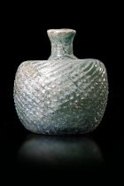 A SPIRAL DECORATED GLASS BOTTLE, PERSIA , 10TH-11TH CENTURY