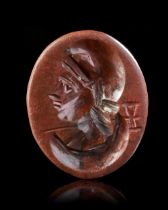 A ROMAN RED JASPER INTAGLIO WITH A BUST OF MEN, 1ST-2ND CENTURY AD