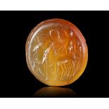 A CARNELIAN INTAGLIO WITH VICTORY IN A BIGA, 2ND CENTURY AD