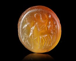 A CARNELIAN INTAGLIO WITH VICTORY IN A BIGA, 2ND CENTURY AD