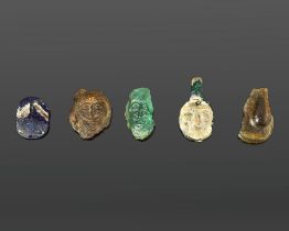 FIVE GLASS ELEMENTS, THREE BOTTLE SEALINGS, ONE PENDANT, ONE INLAY, ABBASID PERIOD 9TH/10TH CENTURY