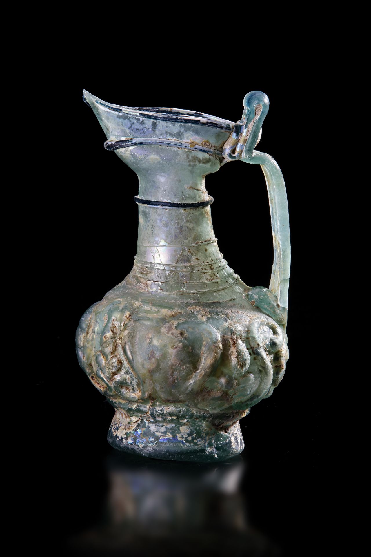 A GLASS EWER WITH SPOUT, PERSIA, 10TH-12TH CENTURY