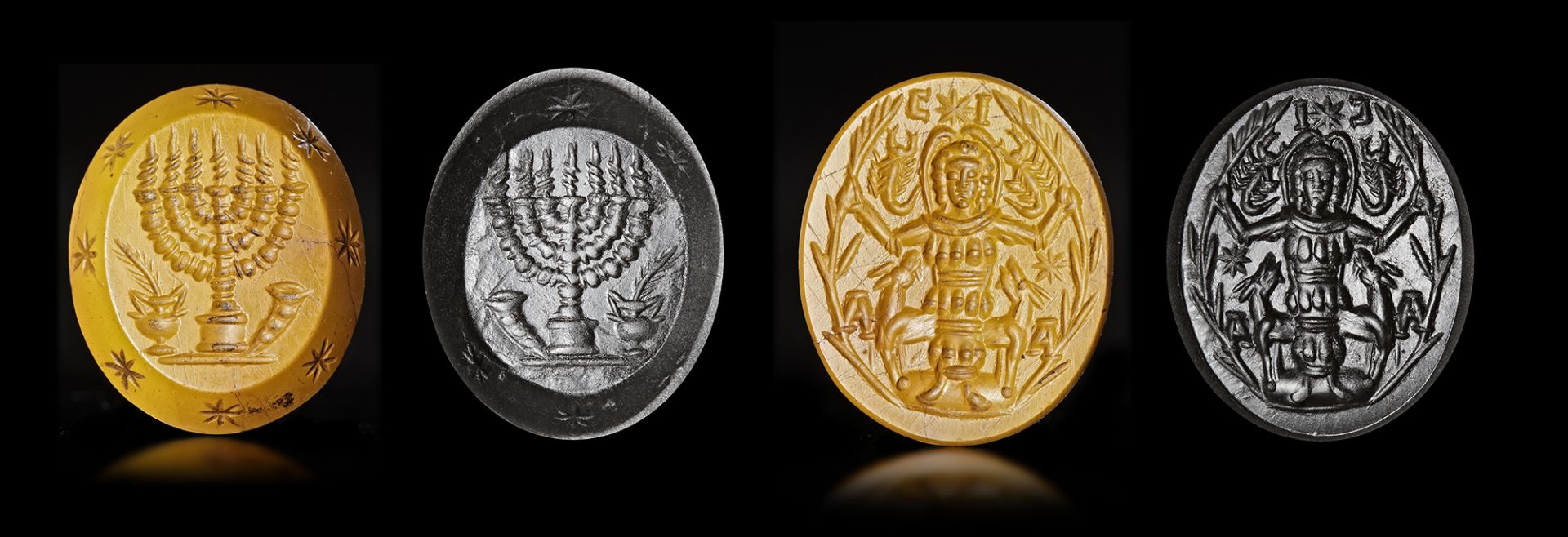 A YELLOW JASPER INTAGLIO WITH A CULT DEITY AND MENORAH ON REVERSE, 3RD CENTURY OR LATER