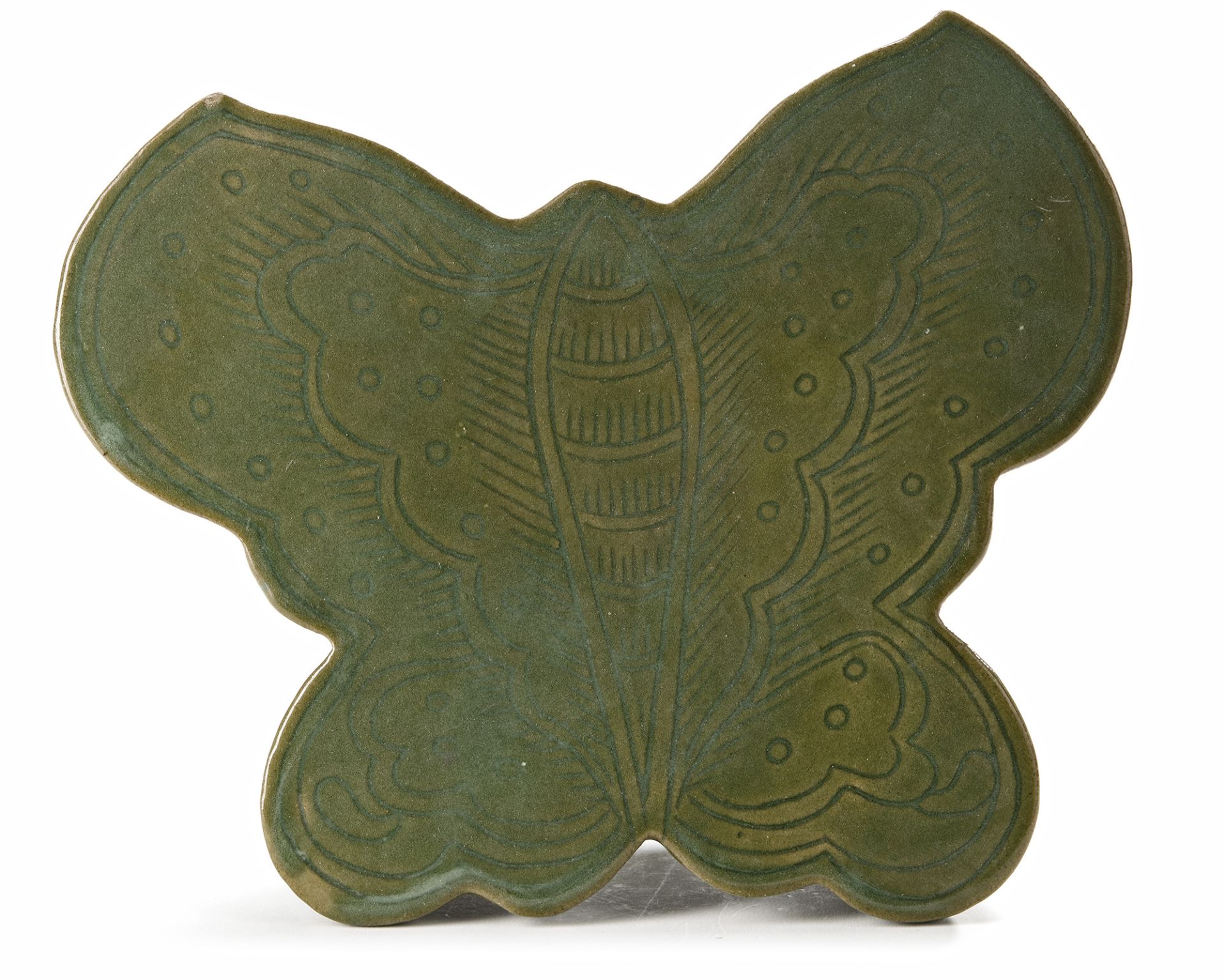 A CHINESE CELADON BUTTERFLY SHAPED PILLOW, MING DYNASTY (1368-1644)
