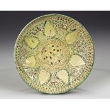 A NISHAPUR BUFFWARE POTTERY BOWL, PERSIA, 10TH CENTURY