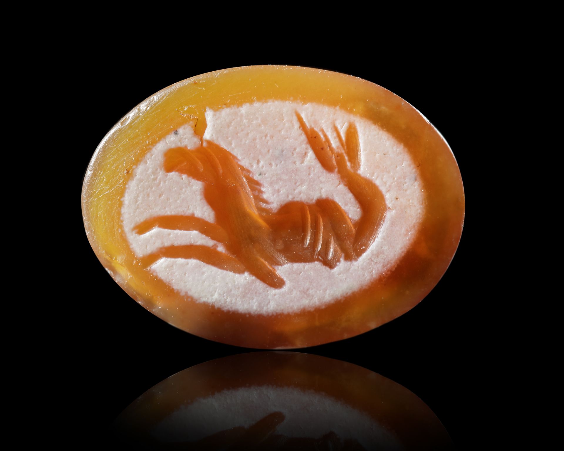 A ROMAN CARNELIAN INTAGLIO WITH SEA MONSTER, 1ST-2ND CENTURY AD