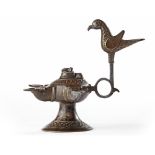 AN UMAYYAD INSCRIBED BRONZE OIL LAMP, POSSIBLY ANDALUSIA, 12TH-13TH CENTURY