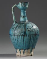 A LARGE RAQQA UNDERGLAZE PAINTED POTTERY EWER, SYRIA, 12TH-13TH CENTURY