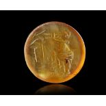 A ROMAN CARNELIAN INTAGLIO OF A SATYR, 1ST CENTURY AD