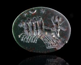 A DARK GREEN JASPER INTAGLIO WITH SOL DRIVING A QUADRIGA, 2ND CENTURY AD