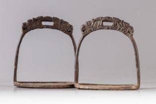 A PAIR OF CHINESE MILITARY CAST-IRON STIRRUPS, 19TH CENTURY