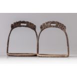 A PAIR OF CHINESE MILITARY CAST-IRON STIRRUPS, 19TH CENTURY