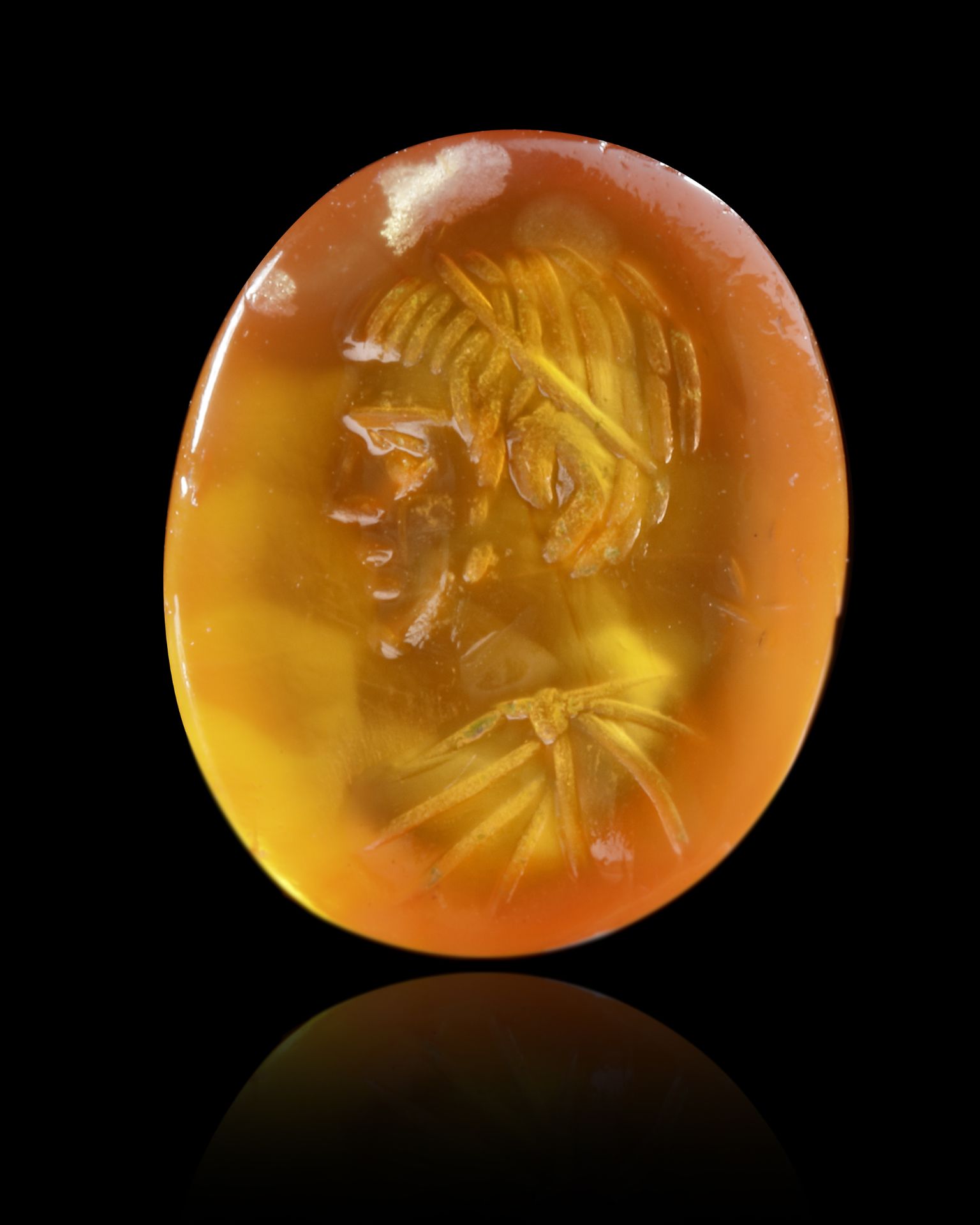 A ROMAN CARNELIAN INTAGLIO WITH A PORTRAIT OF A YOUNG MAN, 2ND-3RD CENTURY AD
