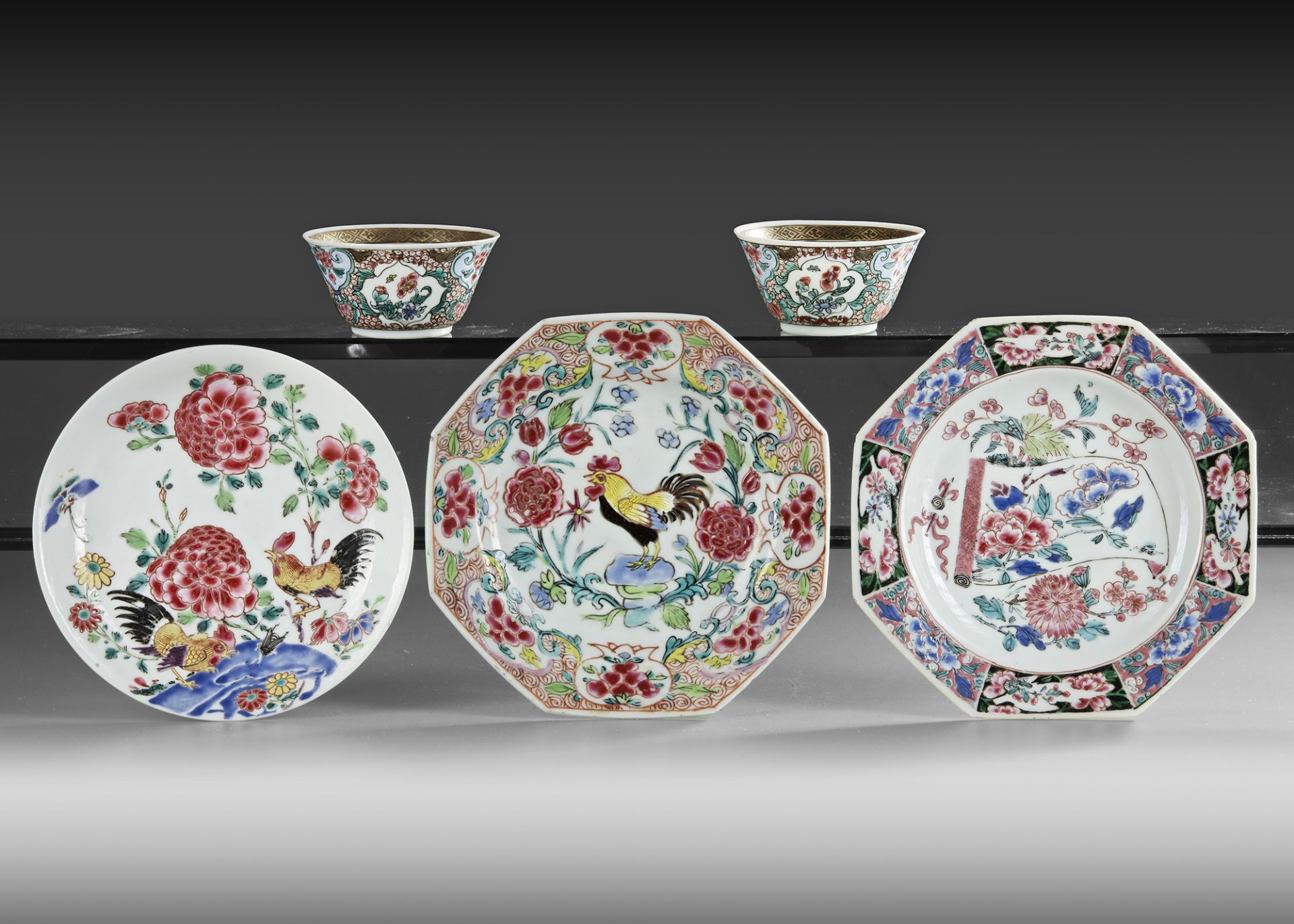 TWO CHINESE FAMILLE ROSE CUPS AND THREE SAUCERS, 18TH CENTURY