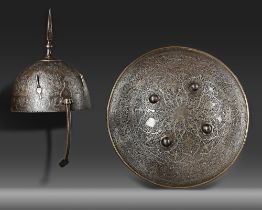 A QAJAR WATERED-STEEL HELMET AND SHIELD, PERSIA 19TH CENTURY