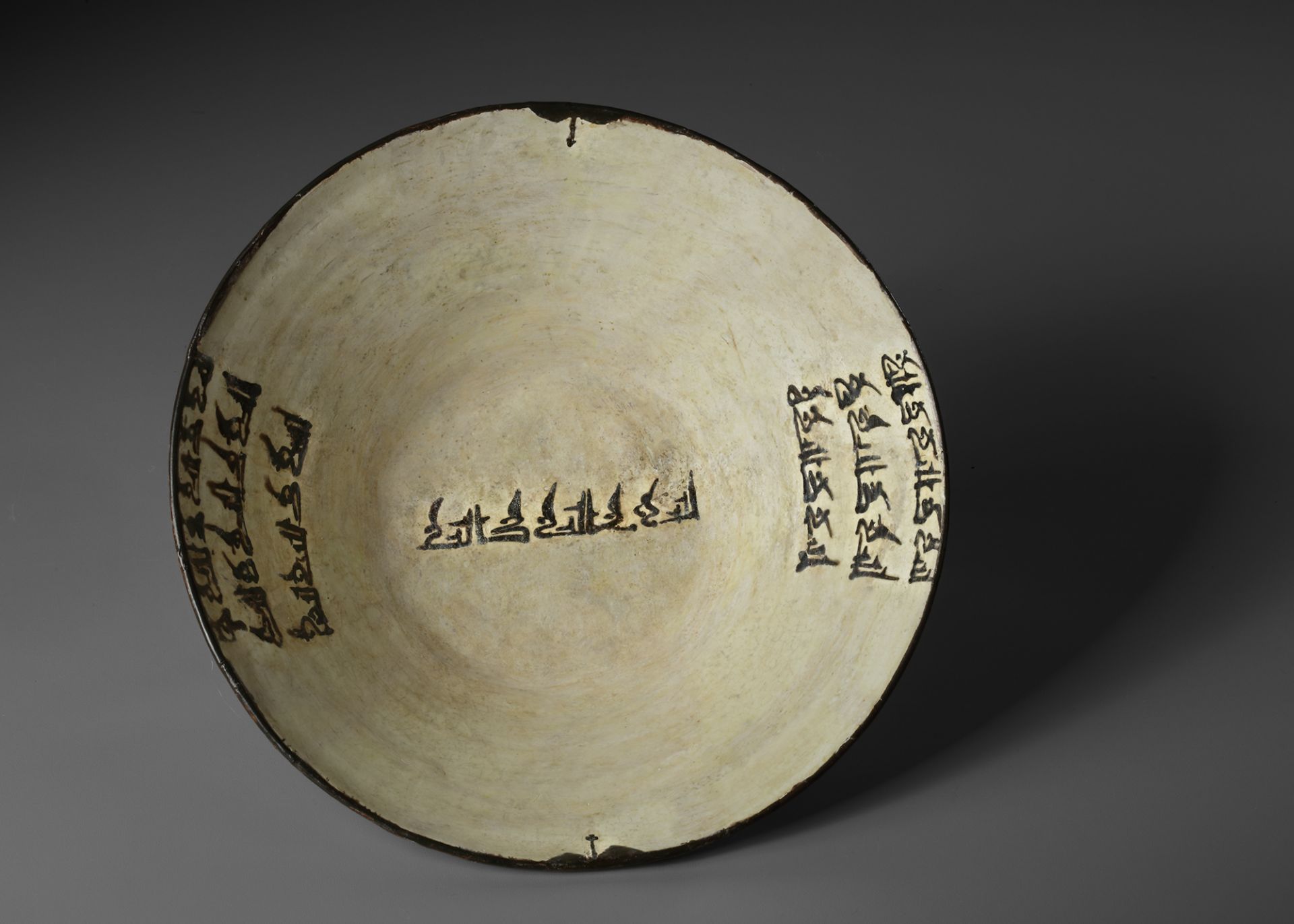 A NISHAPUR CALLIGRAPHIC POTTERY BOWL, PERSIA, 9TH-10TH CENTURY