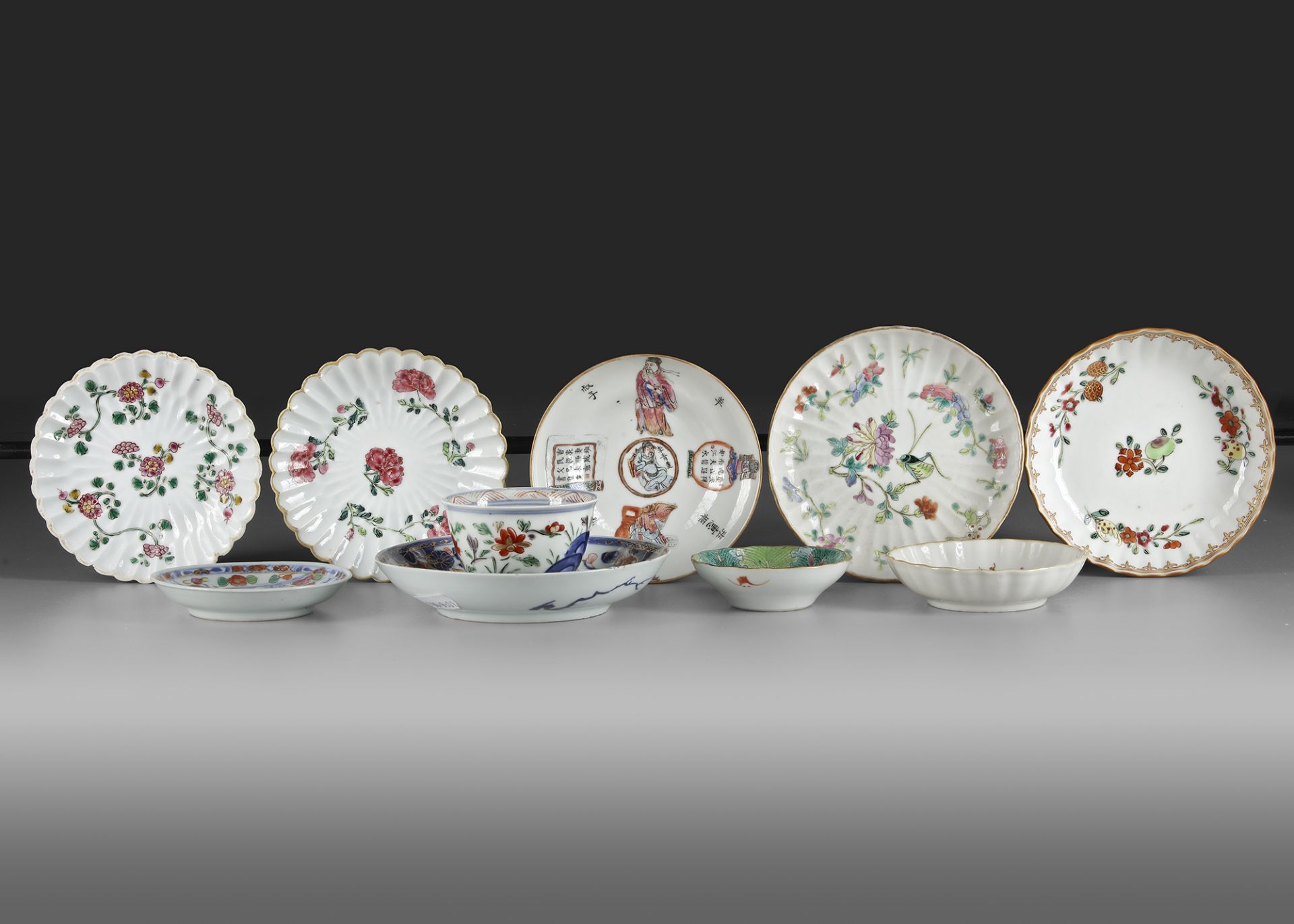 A COLLECTION OF A CUP AND 9 PORCELAIN SAUCERS, 18TH CENTURY AND LATER
