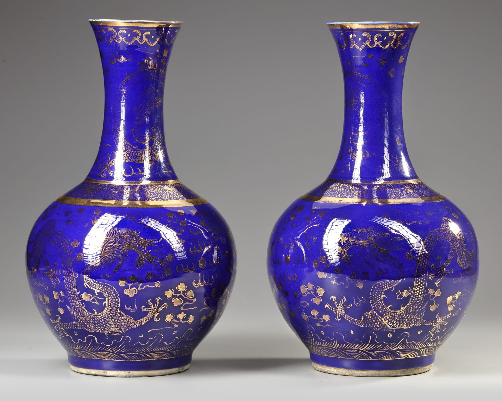 A PAIR OF CHINESE GILT POWDER-BLUE BOTTLE VASES, LATE 19TH-EARLY 20TH CENTURY