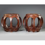 A PAIR OF CHINESE WOODEN BARREL-FORM SEATS, 20TH CENTURY