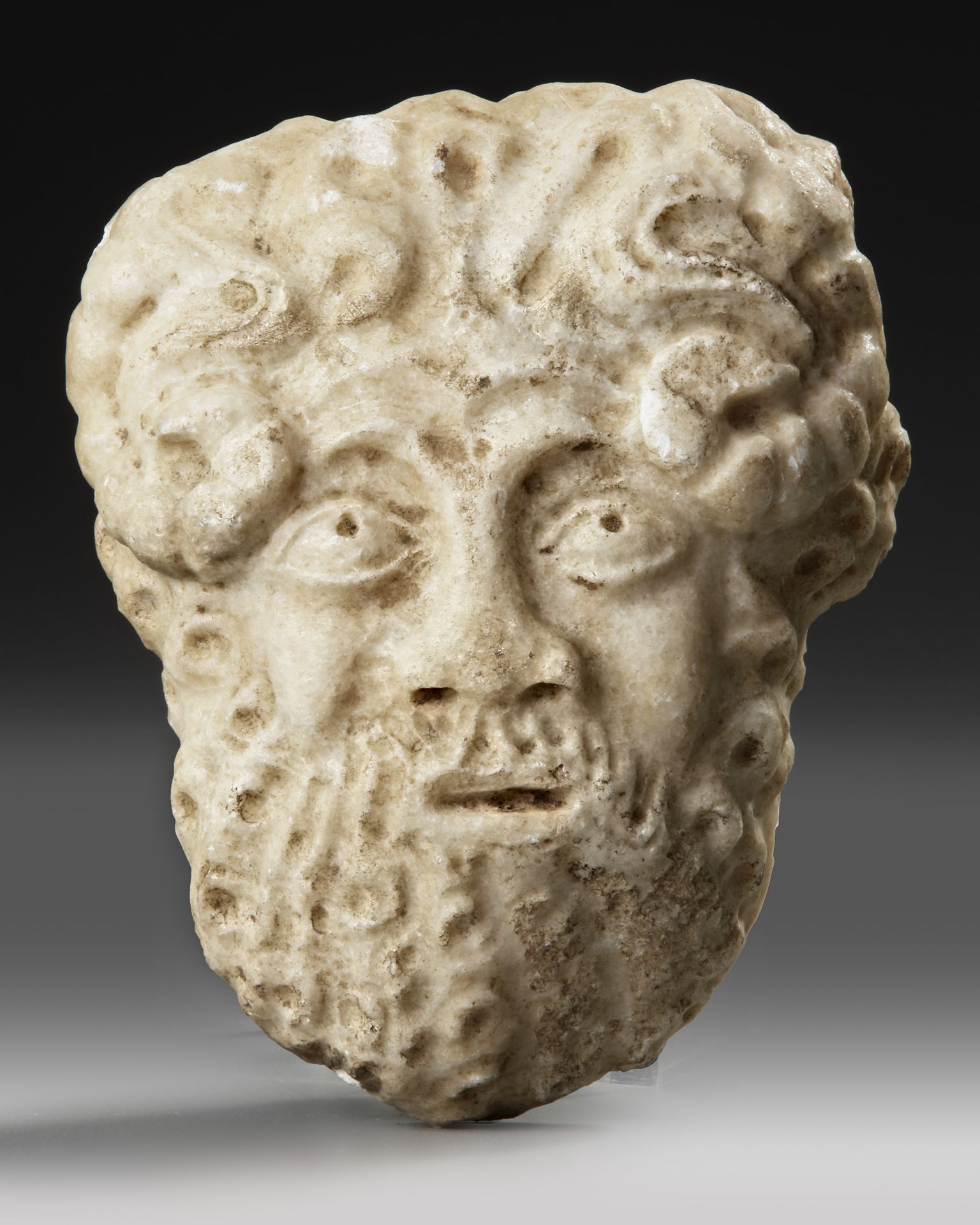 A ROMAN MARBLE HEAD OF SATYR, 2ND CENTURY AD