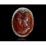 A CARNELIAN INTAGLIO OF MINERVA IN A SILVER MOUNT, 2ND CENTURY AD