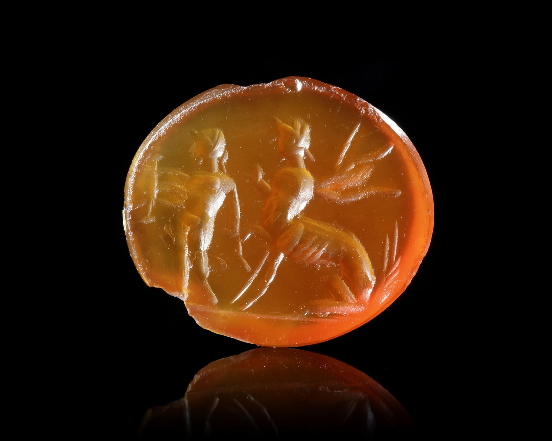 A ROMAN CARNELIAN INTAGLIO SHOWING CHIRON WITH ACHILLES, 1ST CENTURY AD