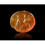 A ROMAN CARNELIAN INTAGLIO SHOWING CHIRON WITH ACHILLES, 1ST CENTURY AD
