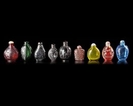 A COLLECTION OF 9 SNUFF BOTTLES IN VARIOUS MATERIALS, QING DYNASTY (1662-1912)