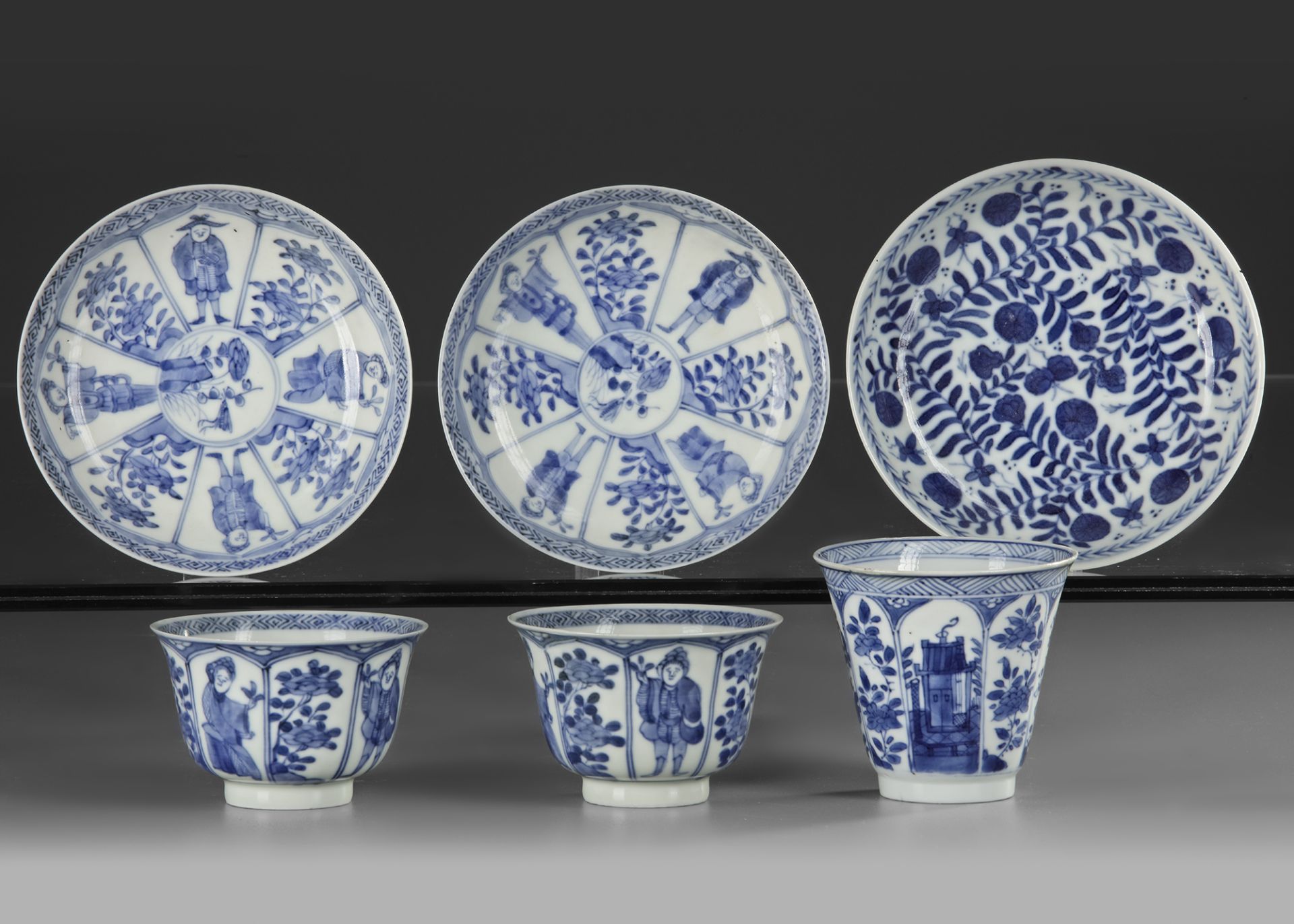 THREE CHINESE BLUE AND WHITE CUPS AND SAUCERS, 18TH CENTURY