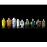 A COLLECTION OF 9 SNUFF BOTTLES IN VARIOUS MATERIALS, QING DYNASTY (1662-1912)