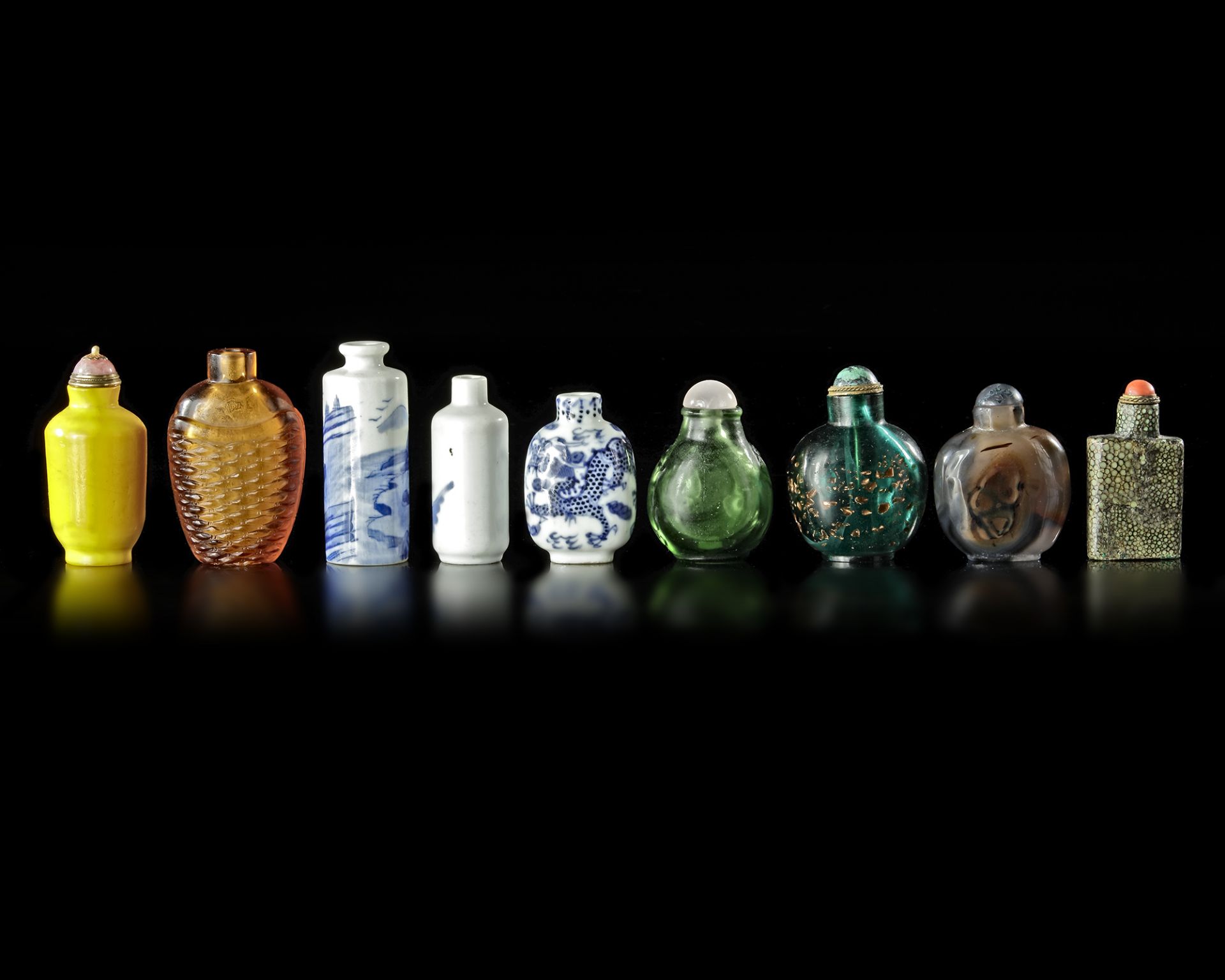 A COLLECTION OF 9 SNUFF BOTTLES IN VARIOUS MATERIALS, QING DYNASTY (1662-1912)