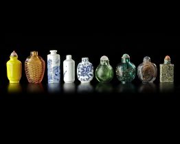 A COLLECTION OF 9 SNUFF BOTTLES IN VARIOUS MATERIALS, QING DYNASTY (1662-1912)